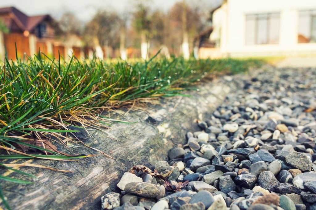 Close-up of wood piece separate aggregate from grass