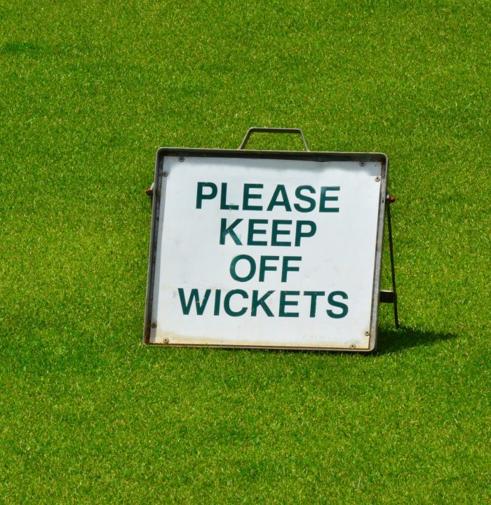 Sign on green grass