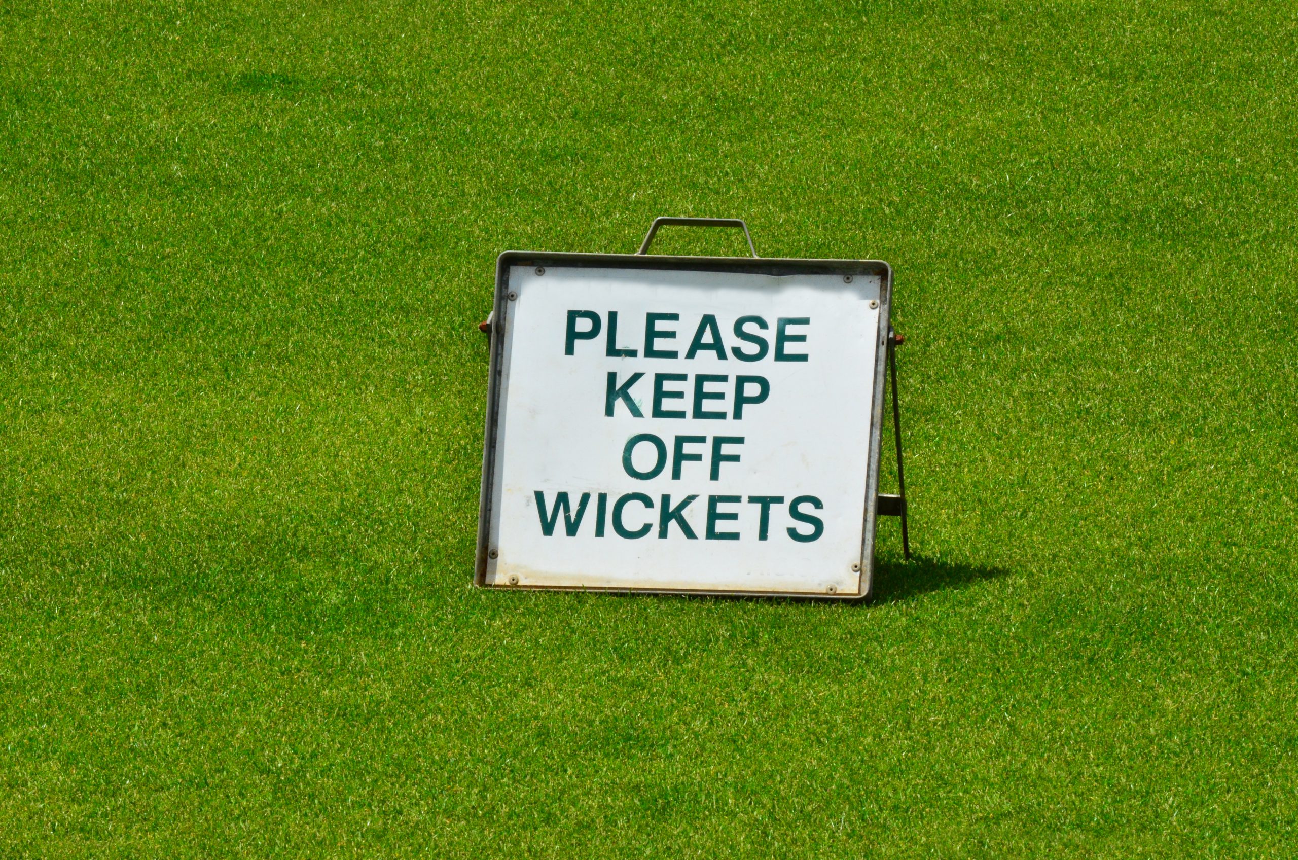Sign on green grass