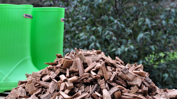 Hardwood chips next to green wellies