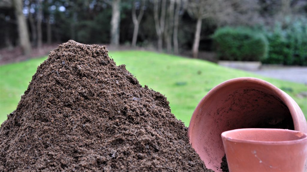 Topsoil next to plant pots